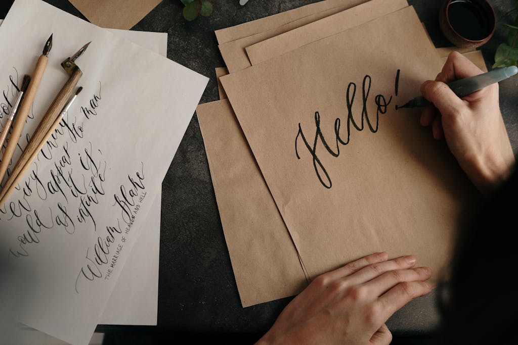 Person writing on a Brown Parchment Paper